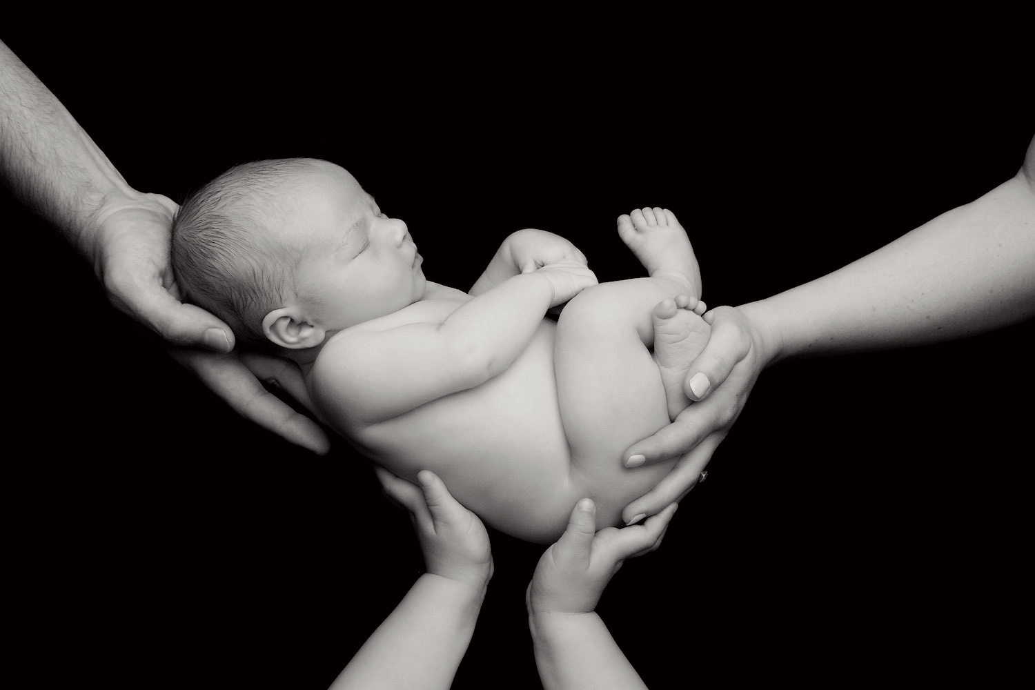 Newborn with hands